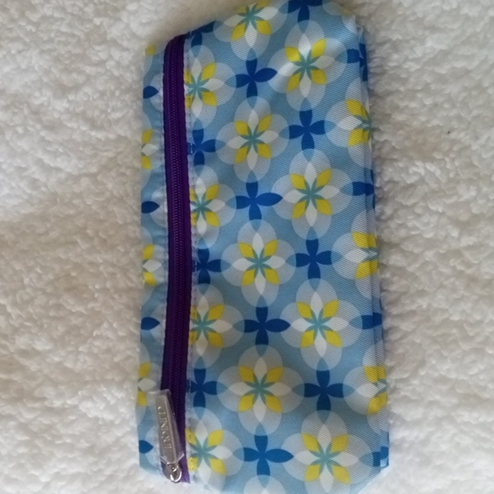Clinique blue, yellow, purple, and white pattern makeup bag